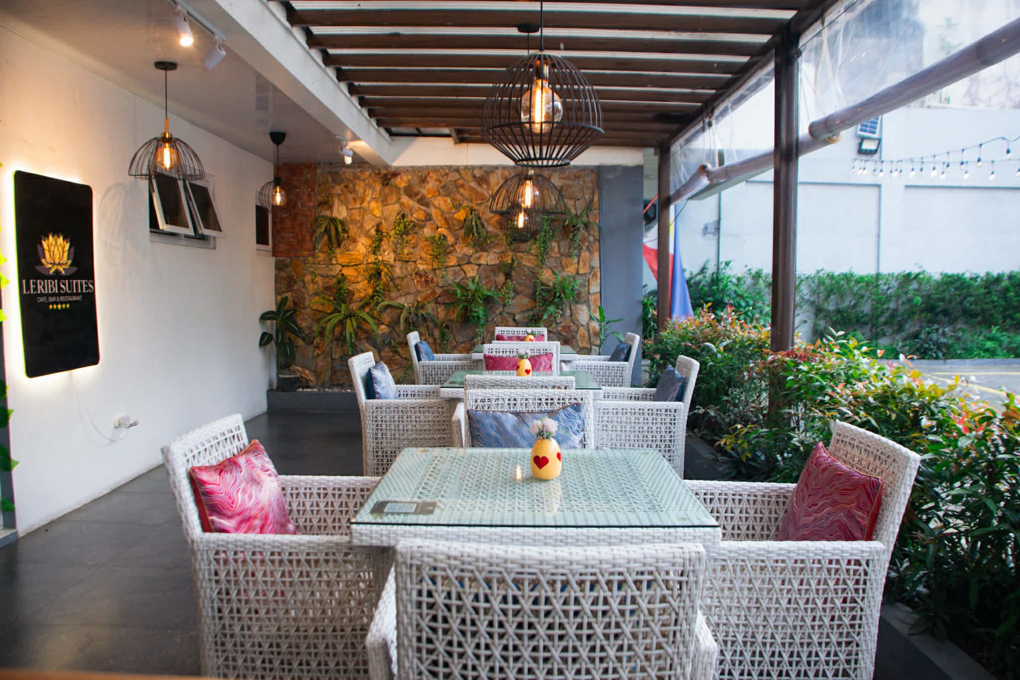 Restaurant table setting at Leribi Suites with plated signature cuisine